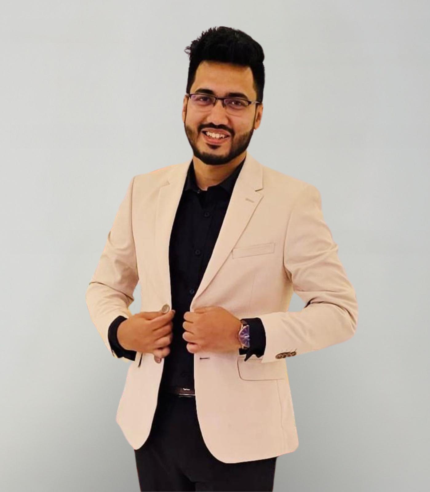 Refayat Ahmed in a light blazer